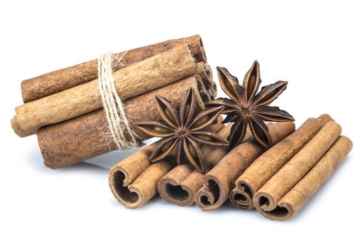 Cinnamon sticks and star anise isolated over a white background