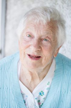 Portrait of a Senior Woman in a blue sweater outside