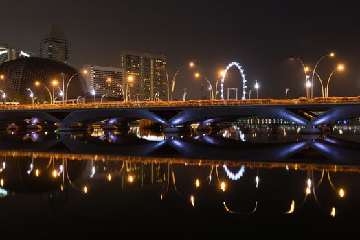 Singapore night skyline of the Esplanade bridge, theater and Singapore Flyer taken from the Esplanade park