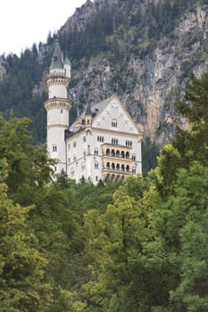 Neuschwanstein Castle is a 19th-century Romanesque Revival palace on a rugged hill above the village of Hohenschwangau near Füssen in southwest Bavaria, Germany. The palace was commissioned by Ludwig II of Bavaria as a retreat and as an homage to Richard Wagner.