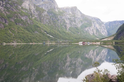 The picture shows somewhere in Norway with mountains and fjords.