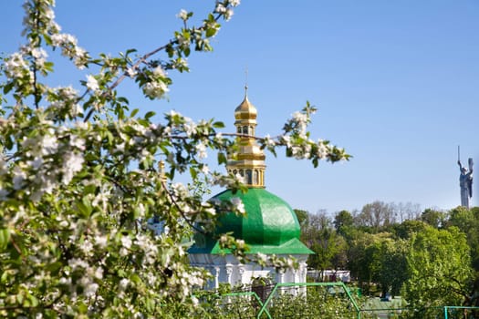 Kiev Pechersk Lavra monastery and tree in blossom