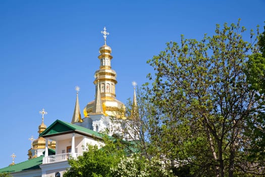 Kyiv Pechersk Lavra golden dome on blue sky