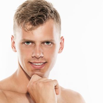 Portrait of young handsome caucasian man over white background