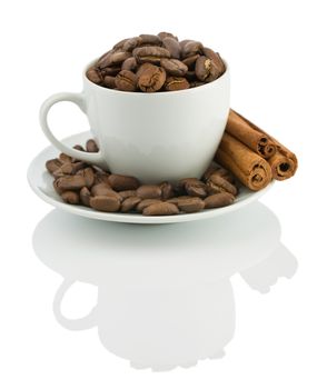 cup with coffee beans and cinnamon sticks isolated