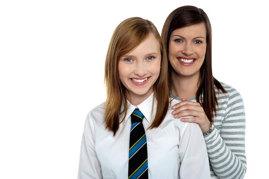 Attractive schoolgirl with her cheerful mother