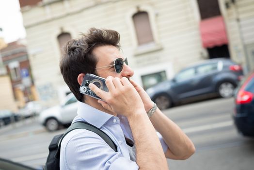 man in the street on the phone in the morning