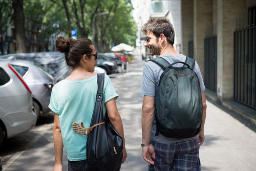 couple waking in the street in the morning