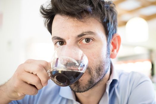 man at the bar drinking coffee in the morning