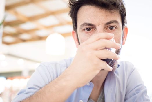 man at the bar drinking coffee in the morning