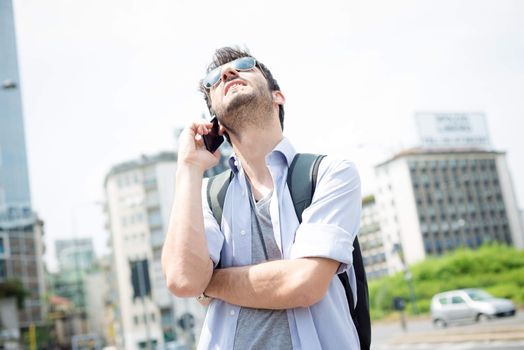 man in the street on the phone in the morning