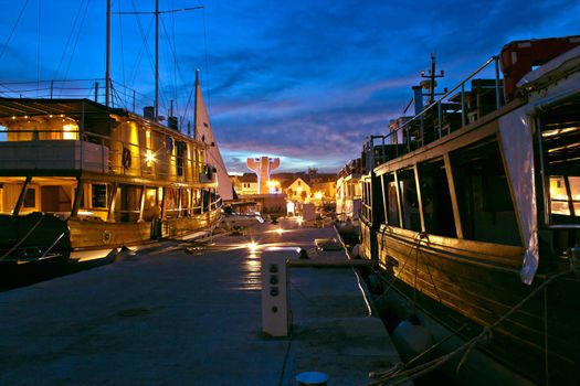 Vodice harbor old wooden ships at evening, Dalmatia, Croatia