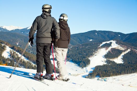 Skiers overlooking ski slope at Bukovel ski resort