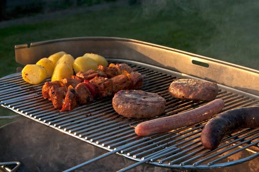 Cooking a Meat on a Barbecue outside in the garden