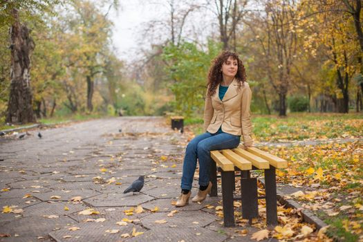 Beautifull girl walk in autumn park