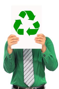 A man in green shirt holding a signboard with a green recycle symbol