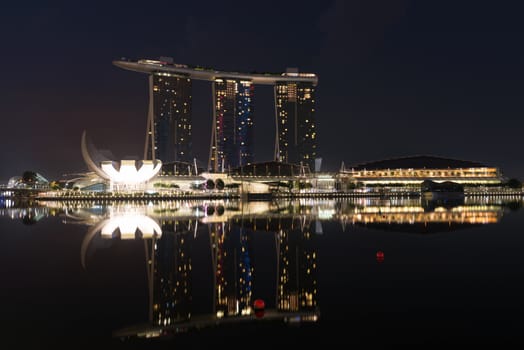 SINGAPORE - JUN 2: The Marina Bay Sands Resort Hotel at night on Jun 02, 2013 in Singapore. It is an integrated resort and the worlds most expensive standalone casino property at SGD8 billion. 