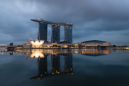 SINGAPORE - JUN 2: The Marina Bay Sands Resort Hotel under morning dark clouds on Jun 02, 2013 in Singapore. It is worlds most expensive standalone casino property at SGD8 billion. 