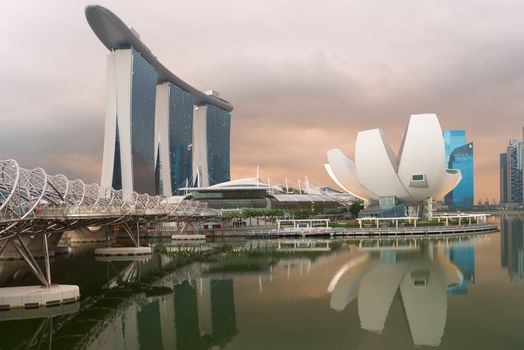 SINGAPORE - JUN 2: The Marina Bay Sands Complex with Helix bridge in front on Jun 02, 2013 in Singapore. Ii is worlds most expensive standalone casino property at SGD8 billion. 