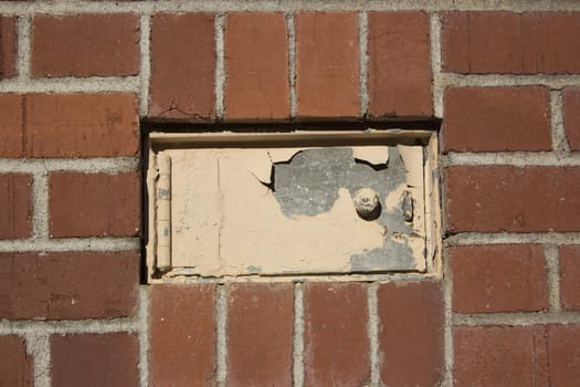 an old hatch door in a brick window
