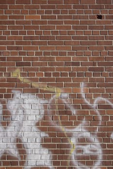 an old brick wall with graffiti