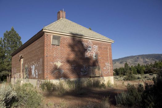 an old brick house in the forest or countryside