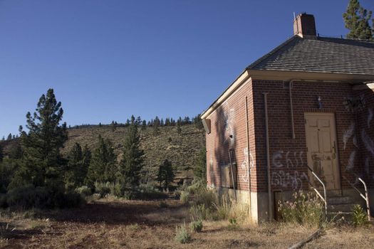 an old brick house in the forest or countryside