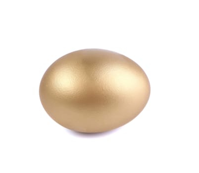 Golden egg, a symbol of making money and successful investment, standing on white background with soft shadow