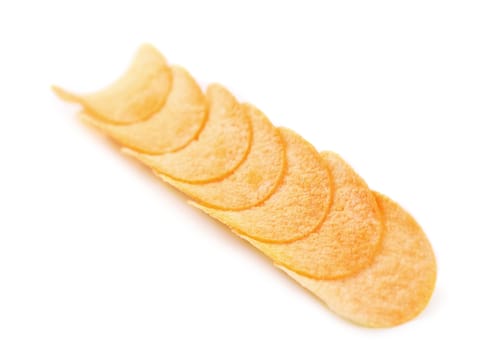 Row potato chips. Photographed on a white background