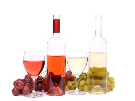 Two glass, two bottles of wine and grapes on the white bsckground