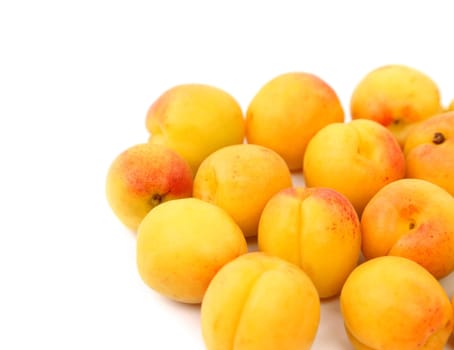 A lot of fresh apricots isolated on a white background