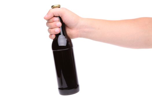 Beer bottle in the hand isolated on white