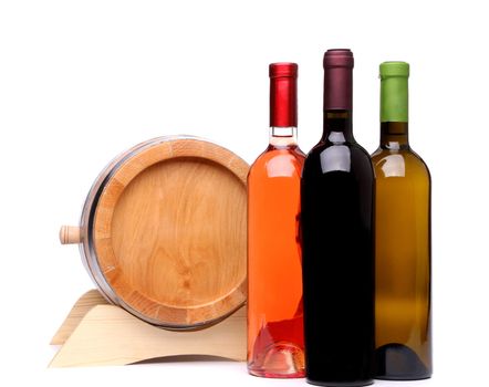 Three wine bottles and wodden barrel on a white background