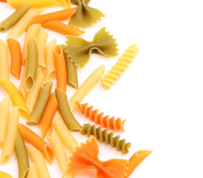 A different pasta in three colors close-up on the white background.