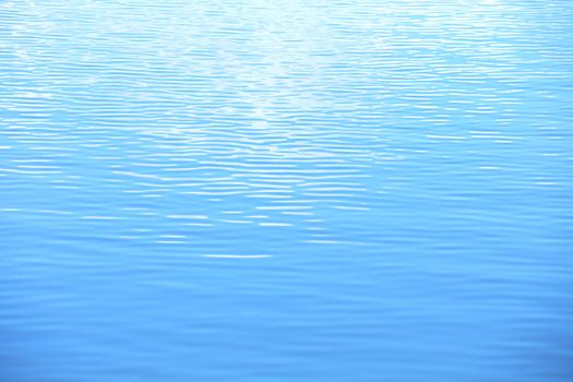 The water is a blue and the small ripples