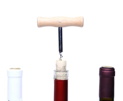 Corkscrew opened and a three wine bottle on a white background