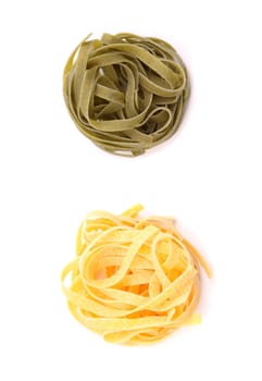 Tagliatelle paglia e fieno homemade tipycal italian pasta close-up on the white background