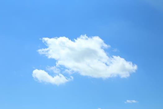 Single cumulus cloud on a blue sky