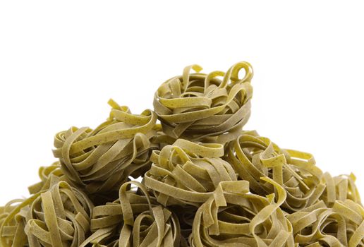 Italian pasta (tagliatelle) with spinach on napkin, closeup