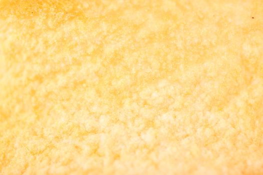 yellow potato chips closeup on whole background