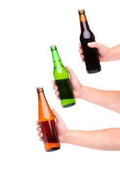 Three beer bottles and three hands isolated on white