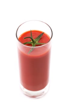 tail into tomato juice glass isolated on white background