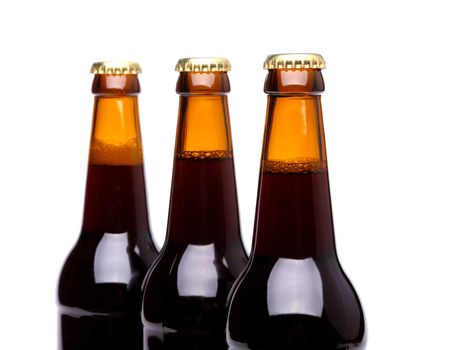 Three bottles of beer isolated on a white bacground