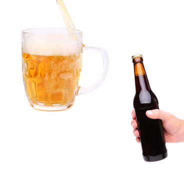 Hand, stream, glass and bottle of beer on a white background
