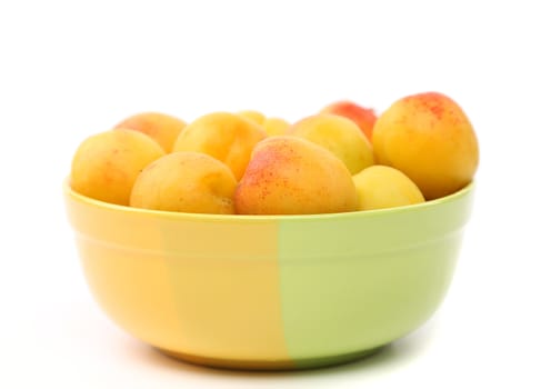 Fresh apricots in cup isolated on white