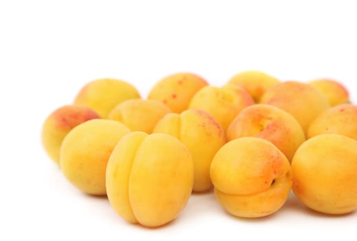 lots of fresh apricots isolated on white