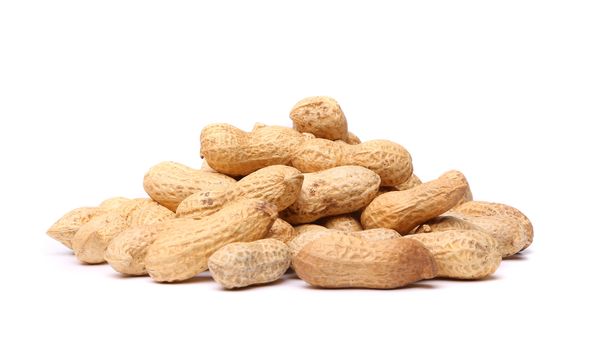 Handful peanuts close-up on a white background