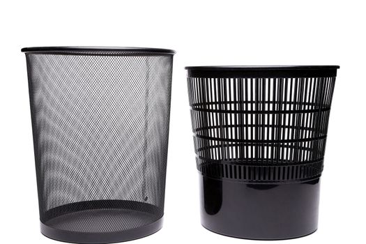 Metal and plastic trash cans on white background