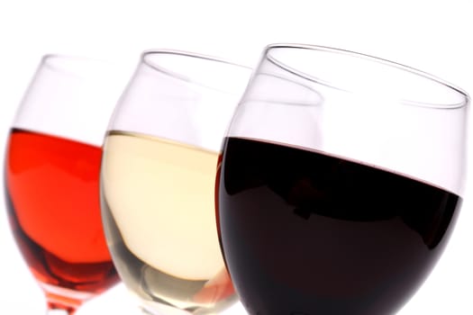 set of three glasses wine close-up on a white background