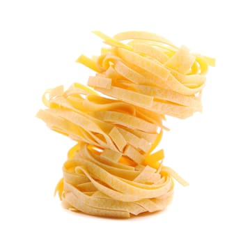 Tagliatelle paglia e fieno homemade tipycal italian pasta close-up on the white background